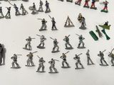 a lot of toy soldiers that are on the table
