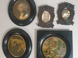 four framed pictures of a man and a woman on the wall