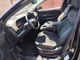 the interior of a car with two seats and a steering wheel
