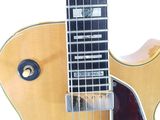 a close up of an electric guitar on a white background