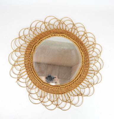 a mirror with a bird in the middle of it