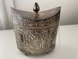 a silver box that is sitting on a table