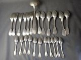 a lot of silver spoons and forks on the table
