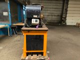 a machine that is sitting on a pallet in a warehouse