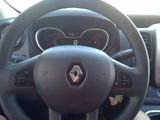the steering wheel of a car with a steering control and dashboard controls