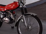 a red motorcycle that is parked in a garage