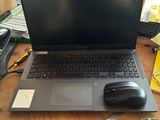 a laptop computer sitting on a table with a mouse on it