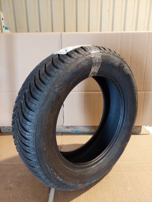 a tire that is sitting on a cardboard box
