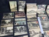 several old black and white photographs of people and buildings on a table