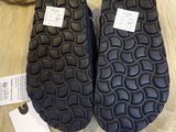 two pairs of shoes that are on the floor
