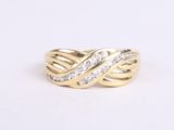 a close up of a gold ring with diamonds on a white background