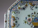 underside view of a blue and white plate with a floral design