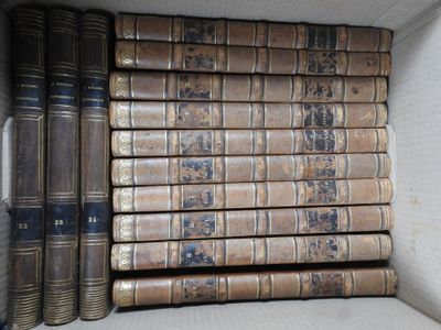 many old books in a white box on the shelf