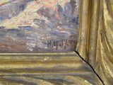 a picture of a painting of a mountain in a gold frame