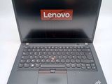 a laptop with a lenovo logo on the screen
