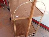 a wooden shelf with a metal frame on it
