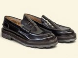 black loafer shoes with rubber soles on a white background