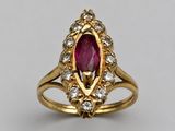 an oval ruby and diamond ring