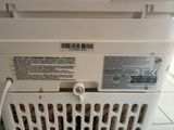an image of a washing machine that is on the floor