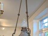 a lamp hanging from the ceiling in a shop