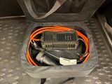 a bag filled with wires and a remote control