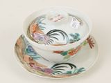 a cup and saucer with a saucer on a saucer