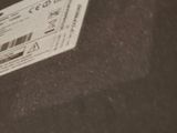 a ticket sitting on the floor next to a pair of shoes