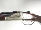a close up of a gun on a table with a white background