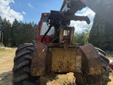 a tractor that is sitting in the grass