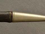 a close up of a pen with a metal tip