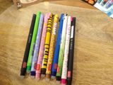 a lot of pens that are sitting on a table