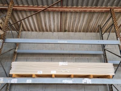 a stack of wooden planks sitting on a pallet