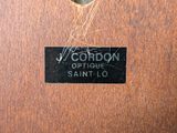 an image of a close up of a label on a wooden cabinet