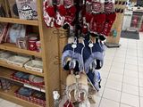 many stuffed animals on display in a store