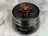 a black and red blender sitting on top of a white counter