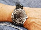 a man that is wearing a watch on his wrist