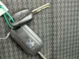 a car key with a tag attached to it