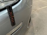 a parking meter on the front of a car