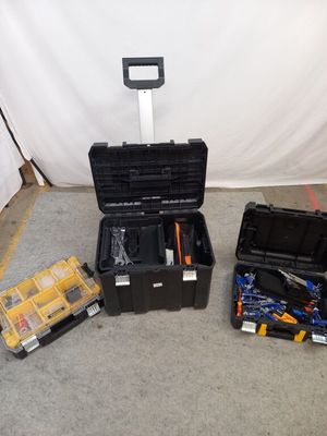 many tools in the case on the floor next to each other