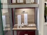 a glass display case with a lot of items in it