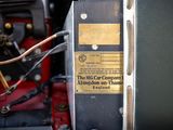 a close up of a car ' s engine with a label on it