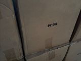 a stack of boxes sitting on top of a carton