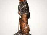 an image of a statue of a boy with a hat and cane