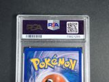 the pokemon card is in a plastic holder on a table