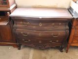 a chest of drawers and a dresser in a room