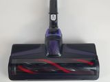 a close up of a vacuum cleaner on a white surface