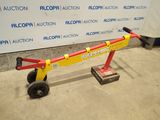 a yellow and red hand truck that is on the ground