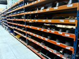 a lot of shelves with hats on them in a store
