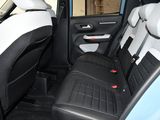 the back seats of a small car are black and white