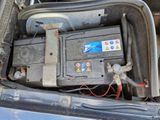a car battery in the trunk of a car